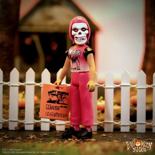 Action figure with skull mask and pink hair in Misfits shirt for Halloween kids fun