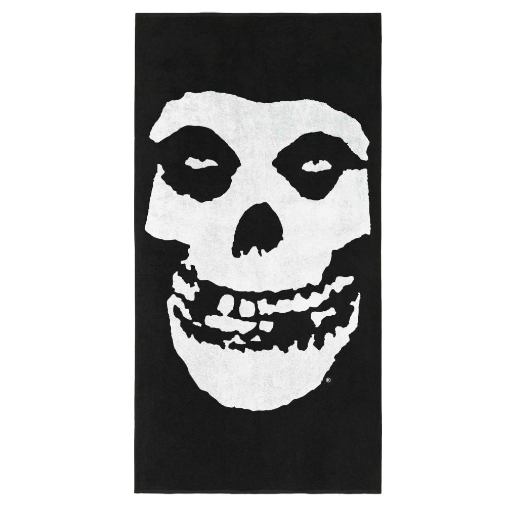 Stylized white skull face on black background for Fiend Skull Beach Towel