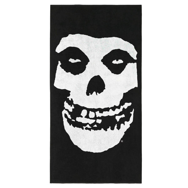 Stylized white skull face on black background for Fiend Skull Beach Towel