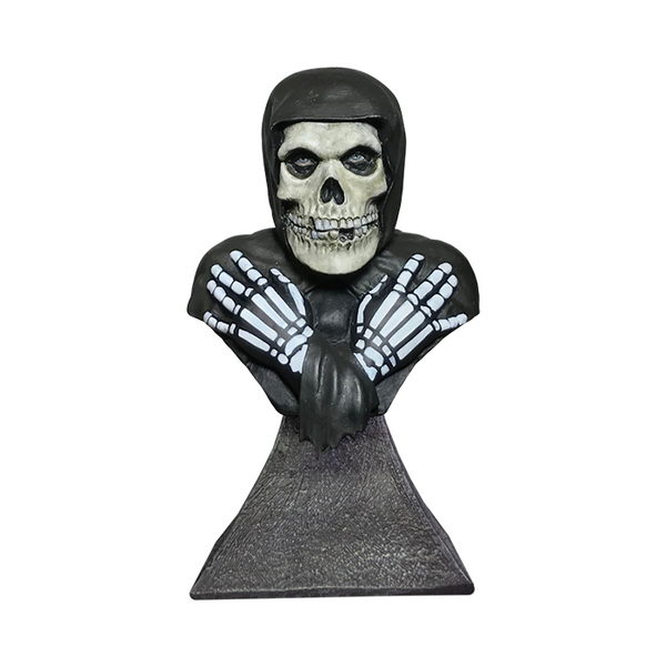 Bust sculpture of a skeletal figure in a hood and gloves from Misfits Fiend Mini