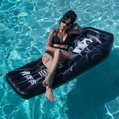 Inflatable Misfits Pool Float with a stylish black and white portrait design