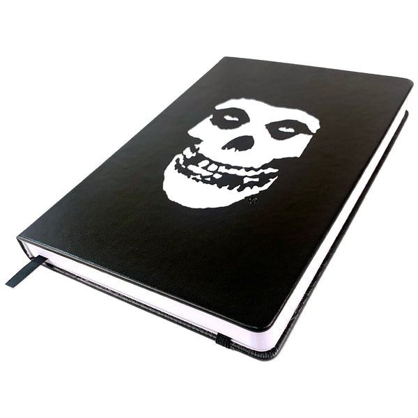 Black notebook featuring Misfits Fiend Skull design on leather bound cover