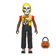 Action figure of a skeleton character in yellow hood, Misfits Halloween Kids Horror Business