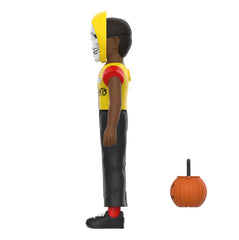 Stylized Misfits Halloween Kids Horror Business figure in yellow and black next to a pumpkin